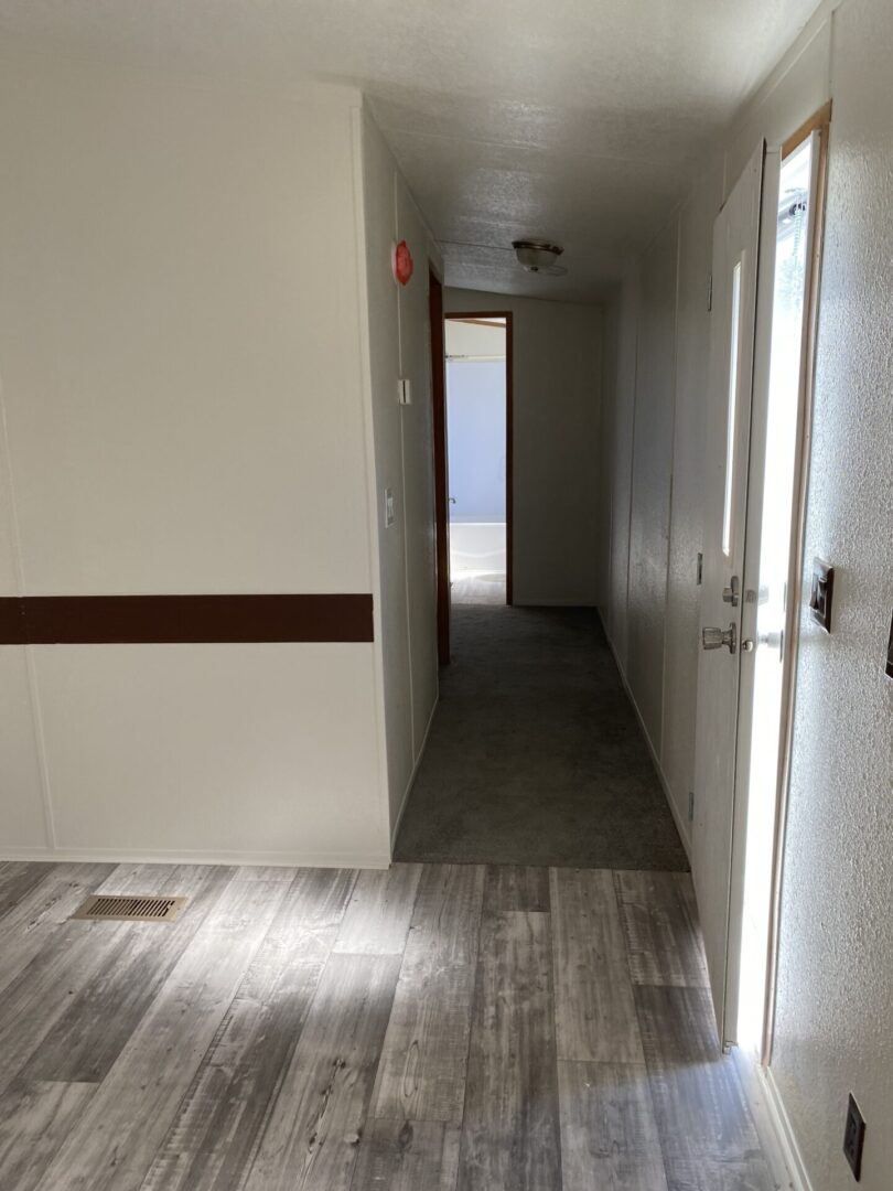 A Hallway Shot With Paneled Wood Flooring
